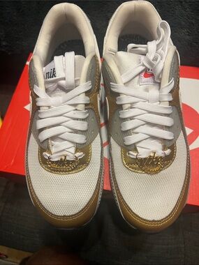 Nike White and Gold Low-Cut Sneakers with Metallic Accents